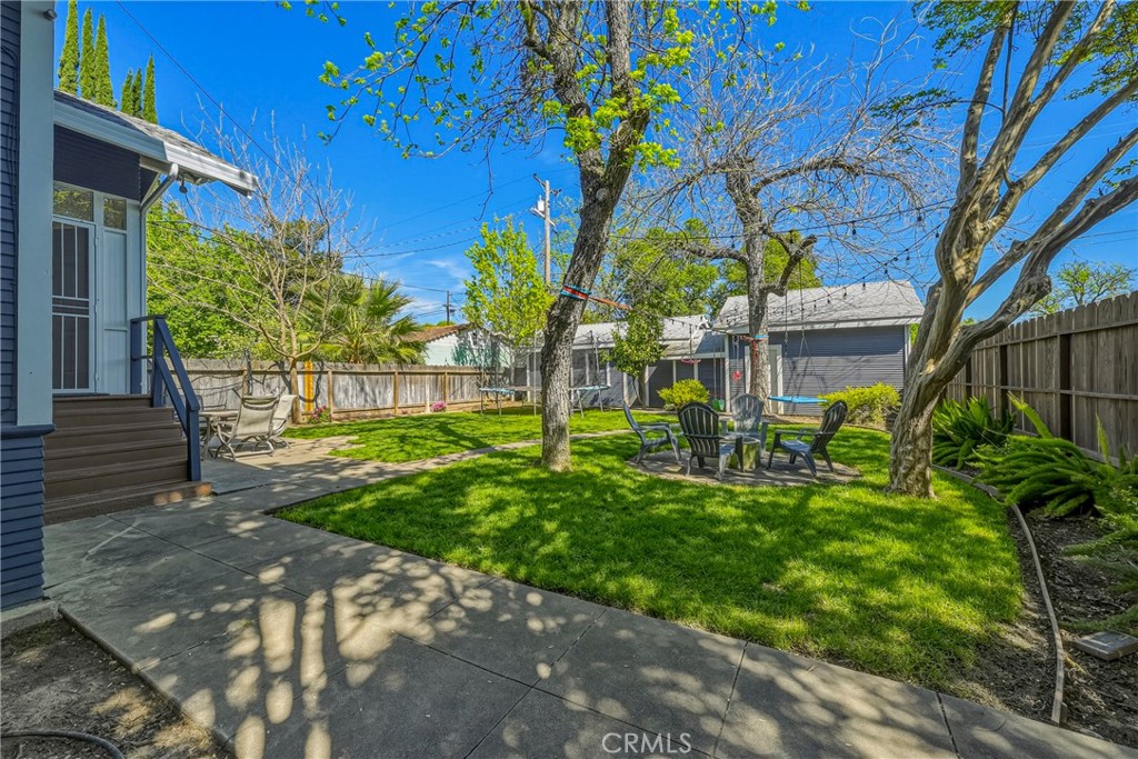 303 West 21st Street Merced, CA 95340 - Photo 48 of 52 a view of backyard of house with outdoor seating and green space