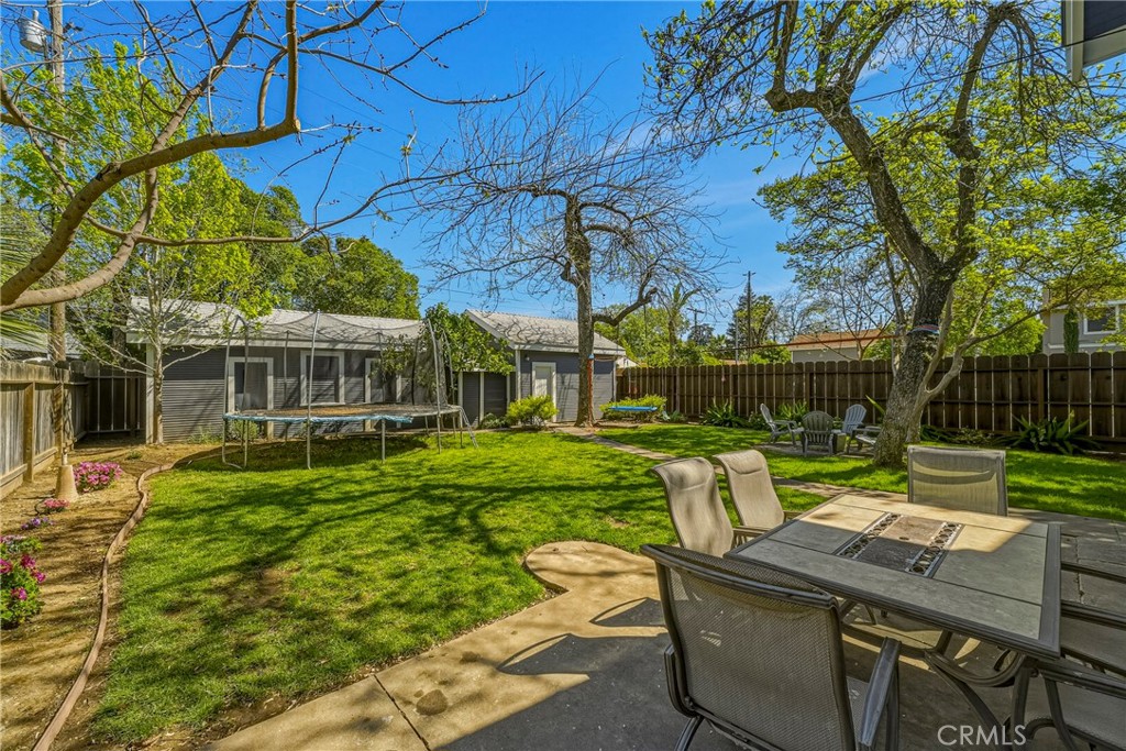 303 West 21st Street Merced, CA 95340 - Photo 50 of 52 a view of a house with backyard sitting area and garden