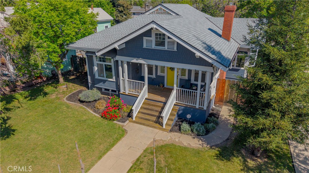 303 West 21st Street Merced, CA 95340 - Photo 10 of 52 an aerial view of a house with swimming pool and wooden fence