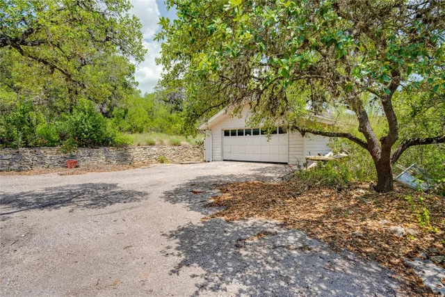 a view of a street with houses on both side
