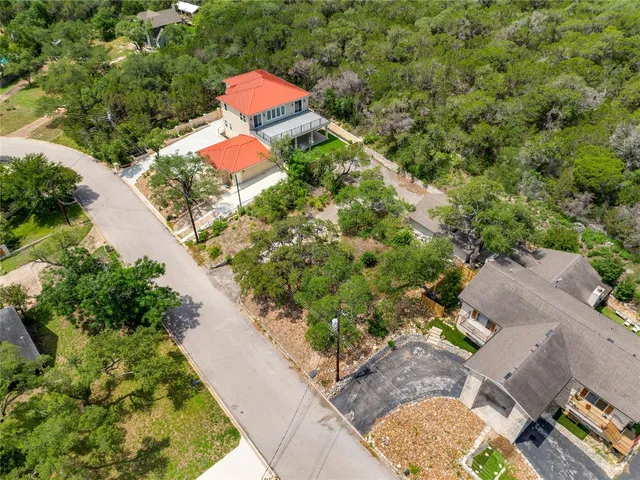 an aerial view of residential house with outdoor space and swimming pool