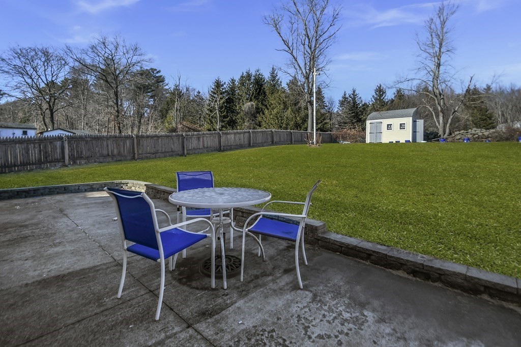 14 Bradford Road Hudson, MA 01749 - Photo 14 of 16 a view of a table and chairs in the garden