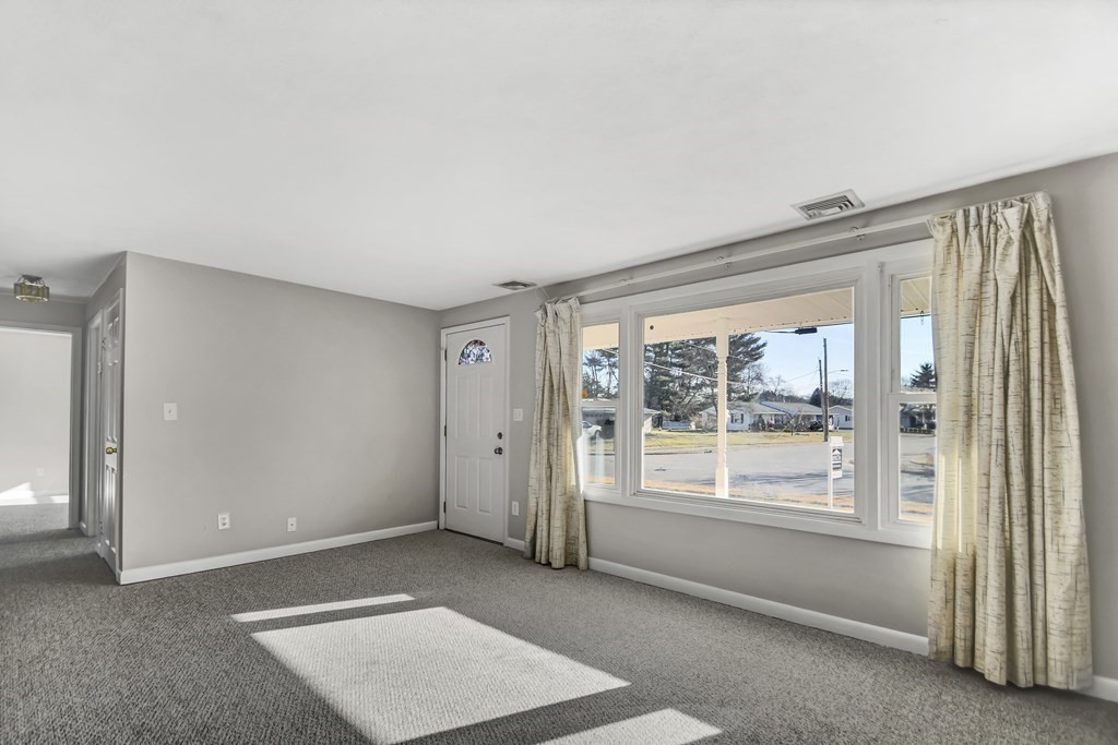 14 Bradford Road Hudson, MA 01749 - Photo 2 of 16 a view of an empty room with a window