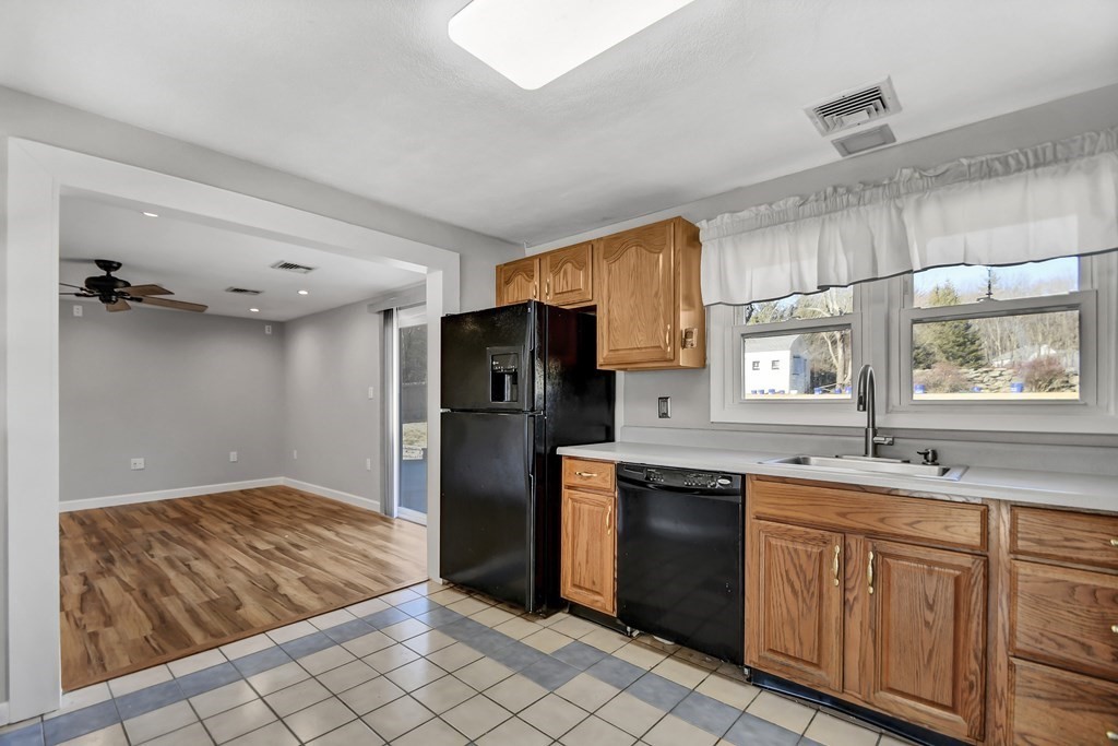 14 Bradford Road Hudson, MA 01749 - Photo 6 of 16 a kitchen with granite countertop a sink stainless steel appliances and cabinets