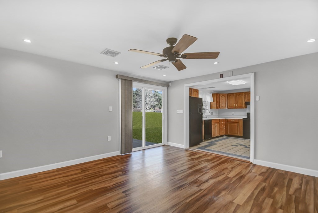 14 Bradford Road Hudson, MA 01749 - Photo 8 of 16 a view of an empty room with a window and wooden floor