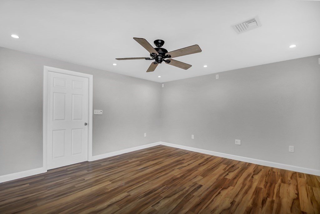 14 Bradford Road Hudson, MA 01749 - Photo 9 of 16 wooden floor in an empty room with a window