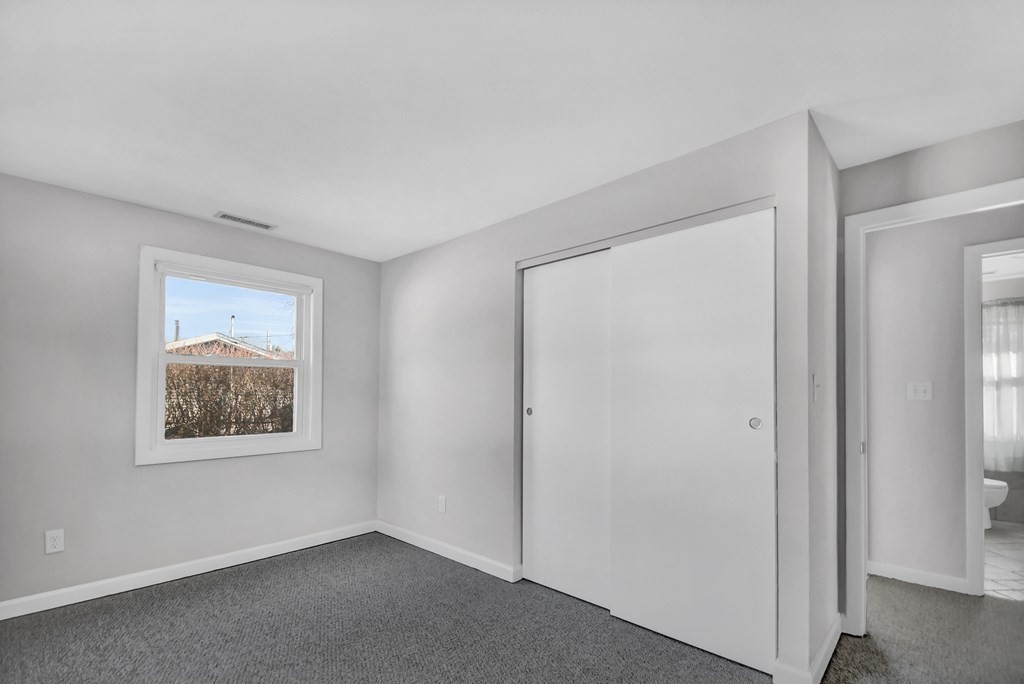 14 Bradford Road Hudson, MA 01749 - Photo 10 of 16 a view of an empty room with a window