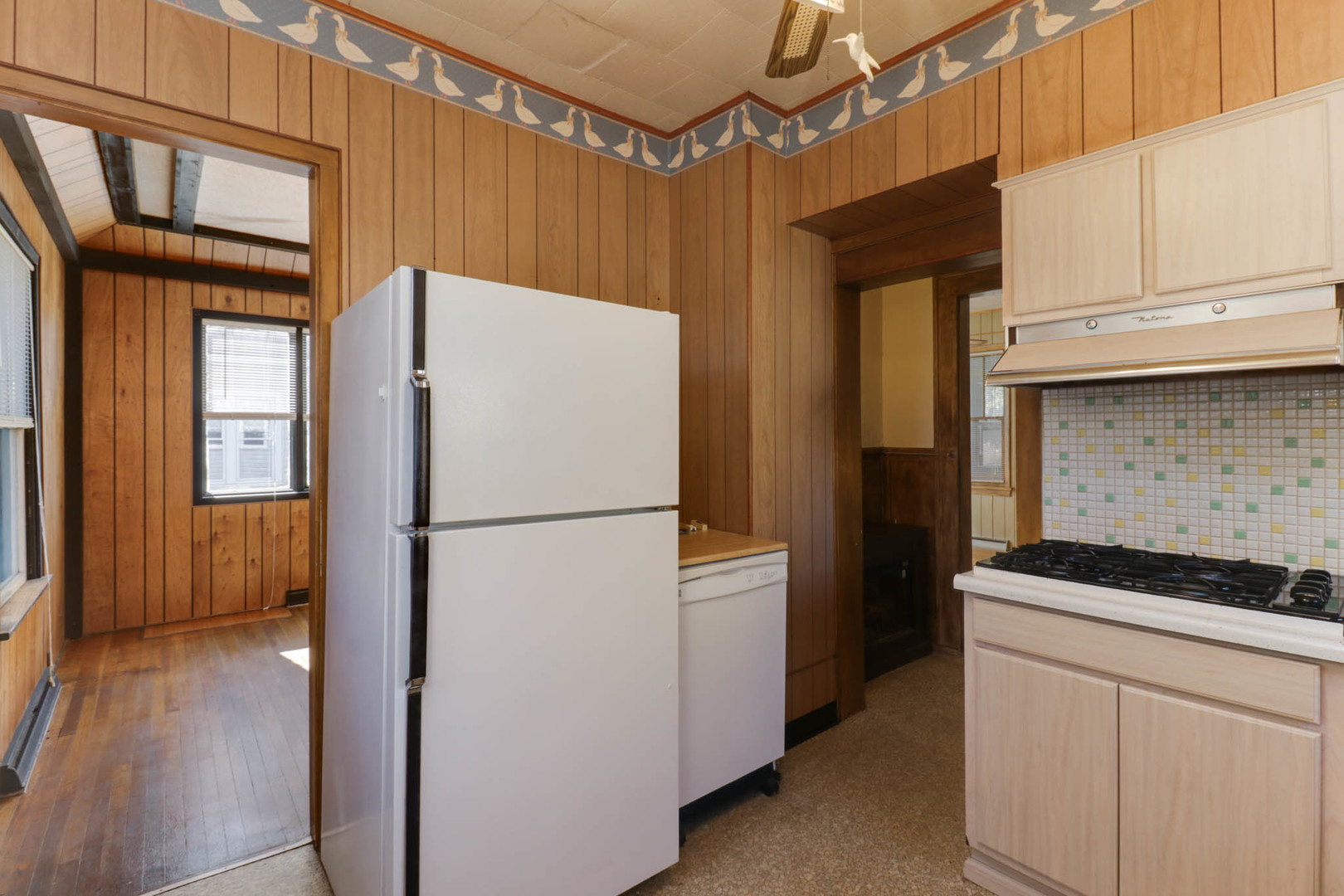 506 South Denver Street Bloomington, IL 61701 - Photo 11 of 41 a white refrigerator freezer and a stove sitting inside of a kitchen