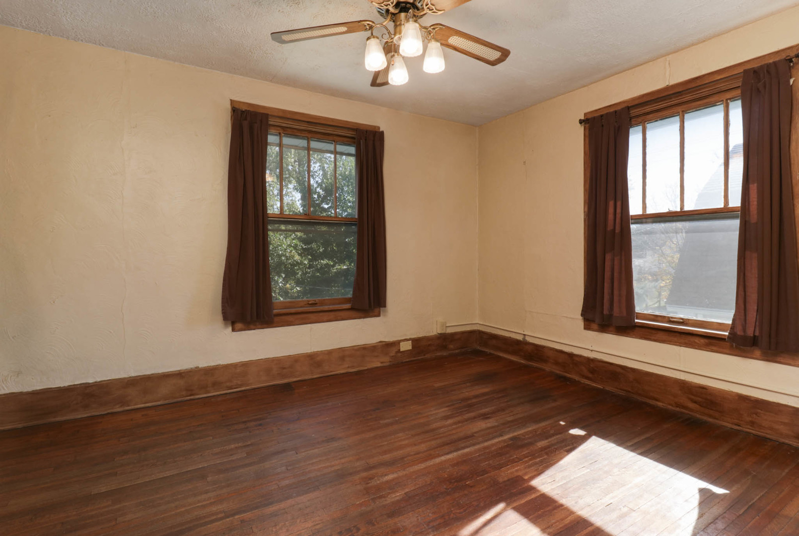 506 South Denver Street Bloomington, IL 61701 - Photo 15 of 41 a view of an empty room with wooden floor and a window