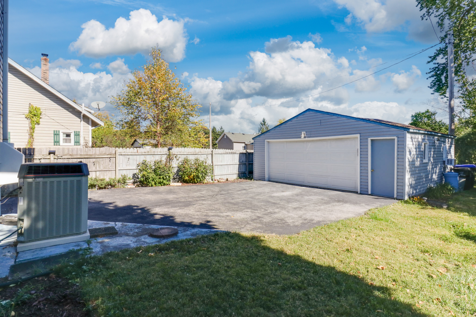506 South Denver Street Bloomington, IL 61701 - Photo 37 of 41 a front view of a house with a yard and garage