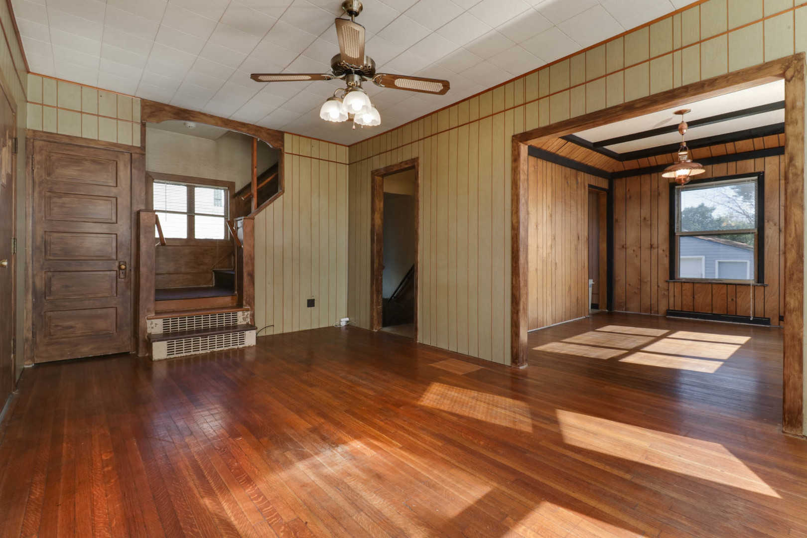 506 South Denver Street Bloomington, IL 61701 - Photo 7 of 41 a view of empty room with wooden floor and fan