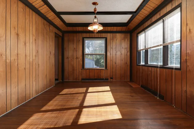 a view of entryway with window and wooden floor
