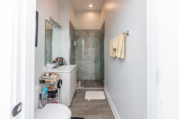 a bathroom with a sink toilet and shower