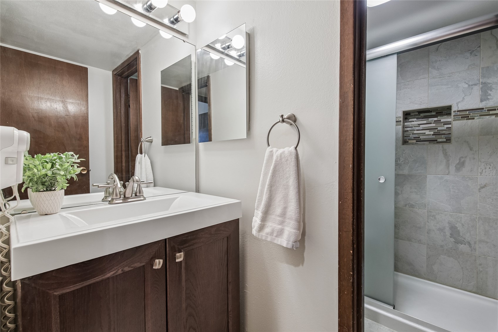 423 Wild Irishman Road, Unit 1008 1009 Keystone, CO 80435 - Photo 19 of 28 a bathroom with a sink vanity and mirror