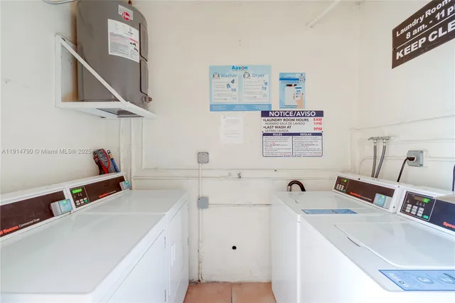 a room with a sink and a washer dryer
