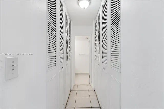 an entryway with a rug