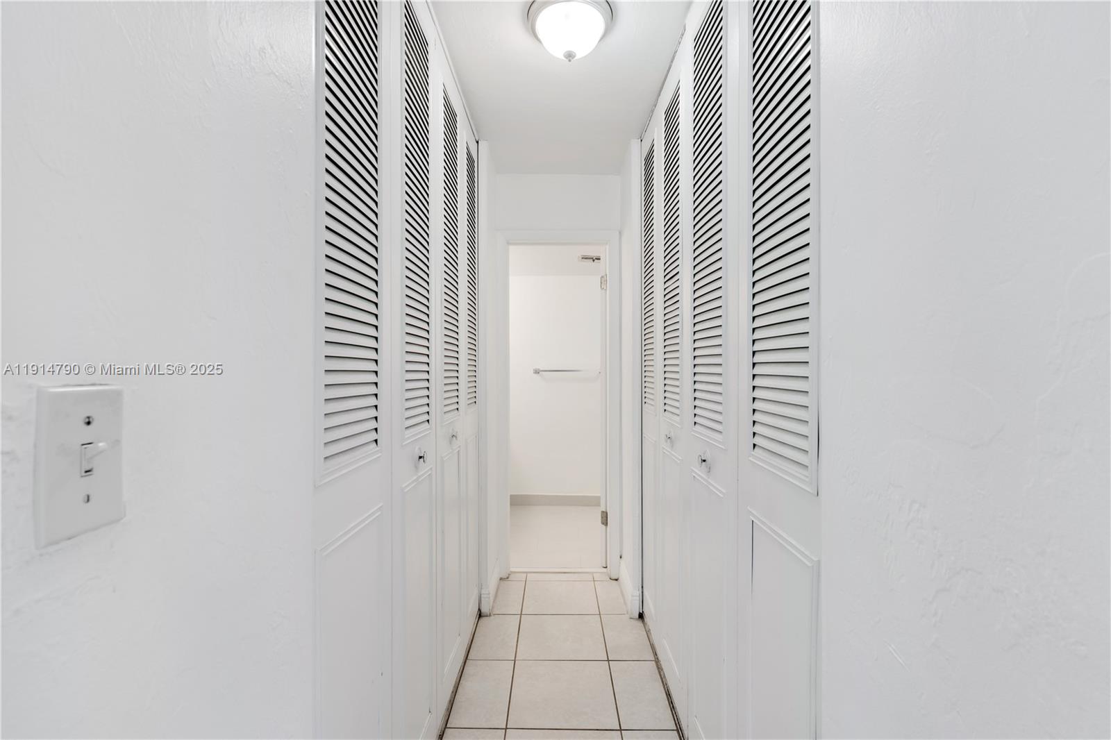 9423 Southwest 76th Street, Unit W21 Miami, FL 33173 - Photo 10 of 20 an entryway with a rug