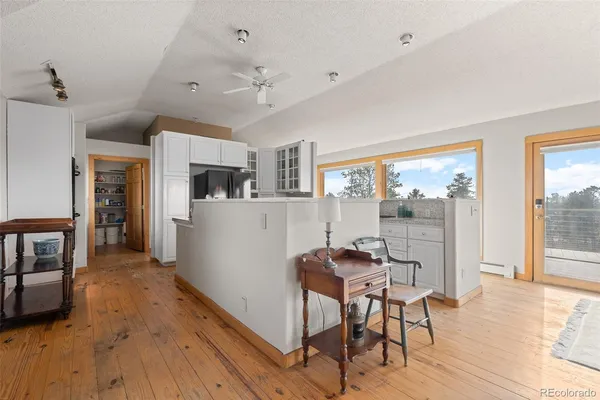 a view of a kitchen and dining room