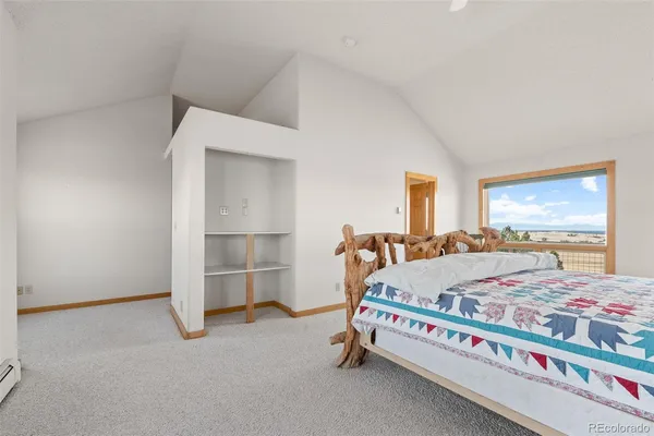 a bed room with a bed and a window