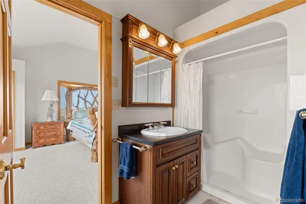 a utility room with window a sink and a mirror