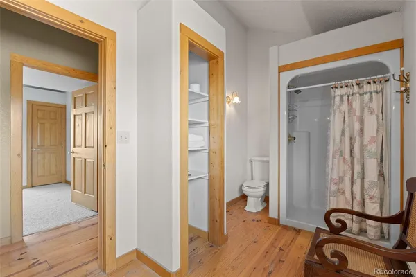 a view of a bathroom with a tub and shower