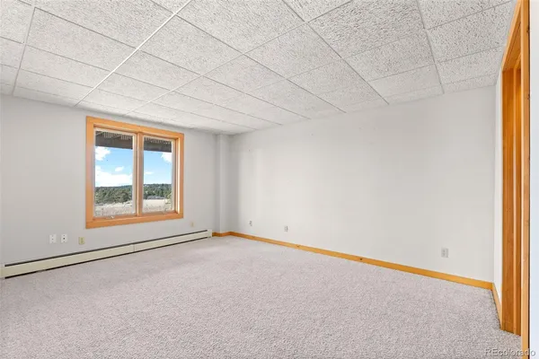 an empty room with a empty space and windows