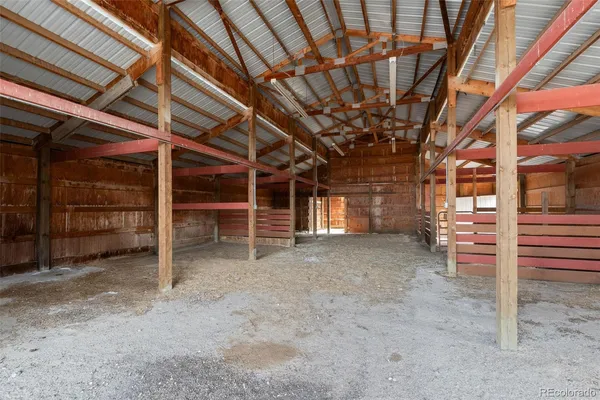 a view of an empty room with wooden walls