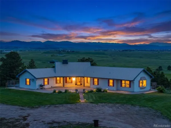 a view of a big house with a big yard