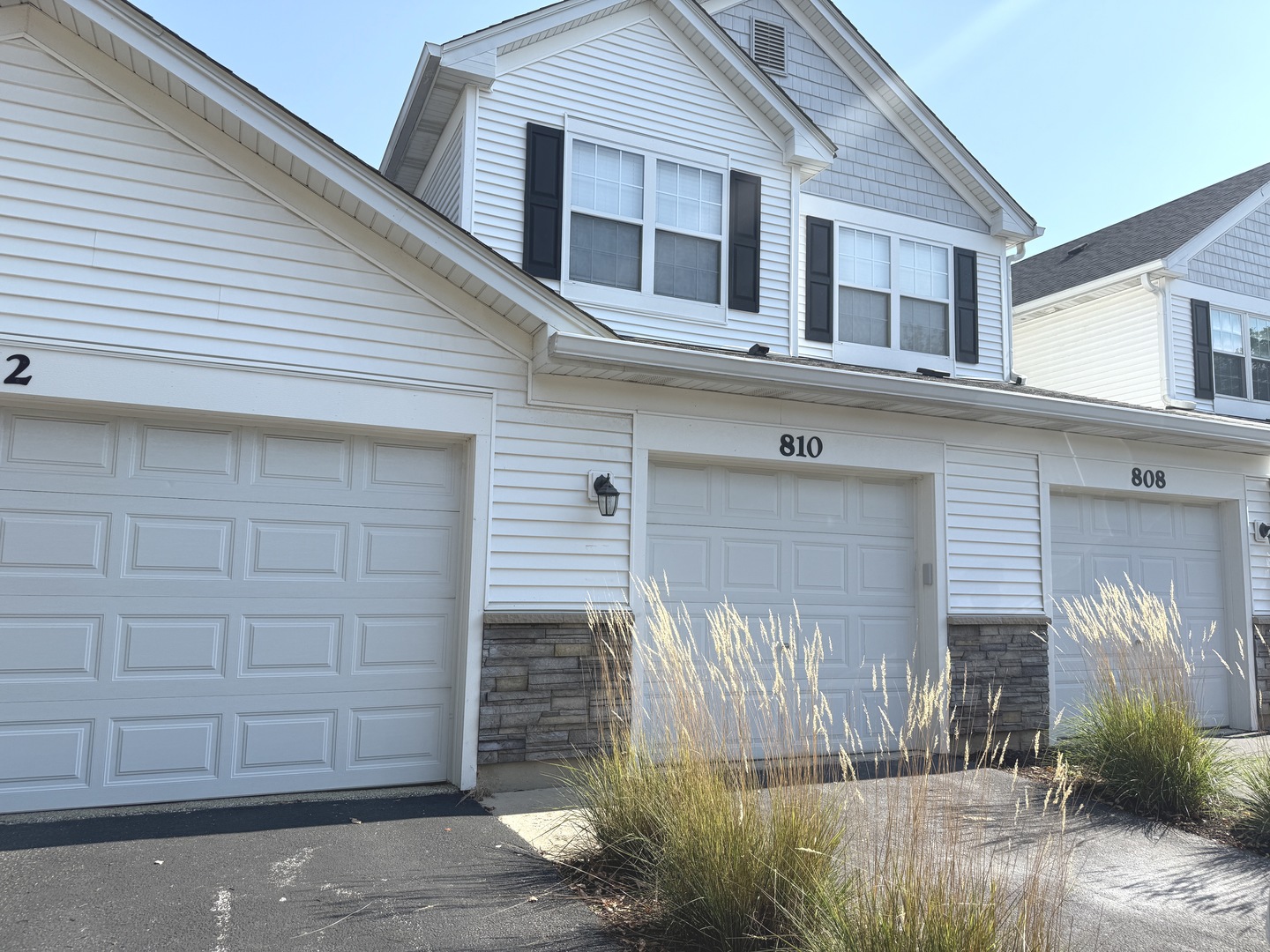 810 Woodewind Drive, Unit 810 Naperville, IL 60563 - Photo 1 of 16 a front view of a house with garden