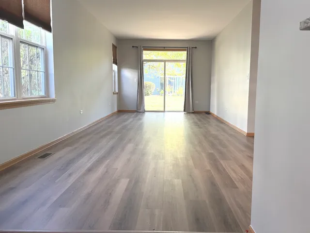 a view of kitchen and wooden floor