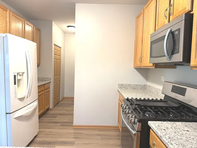 a view of a kitchen from the hallway