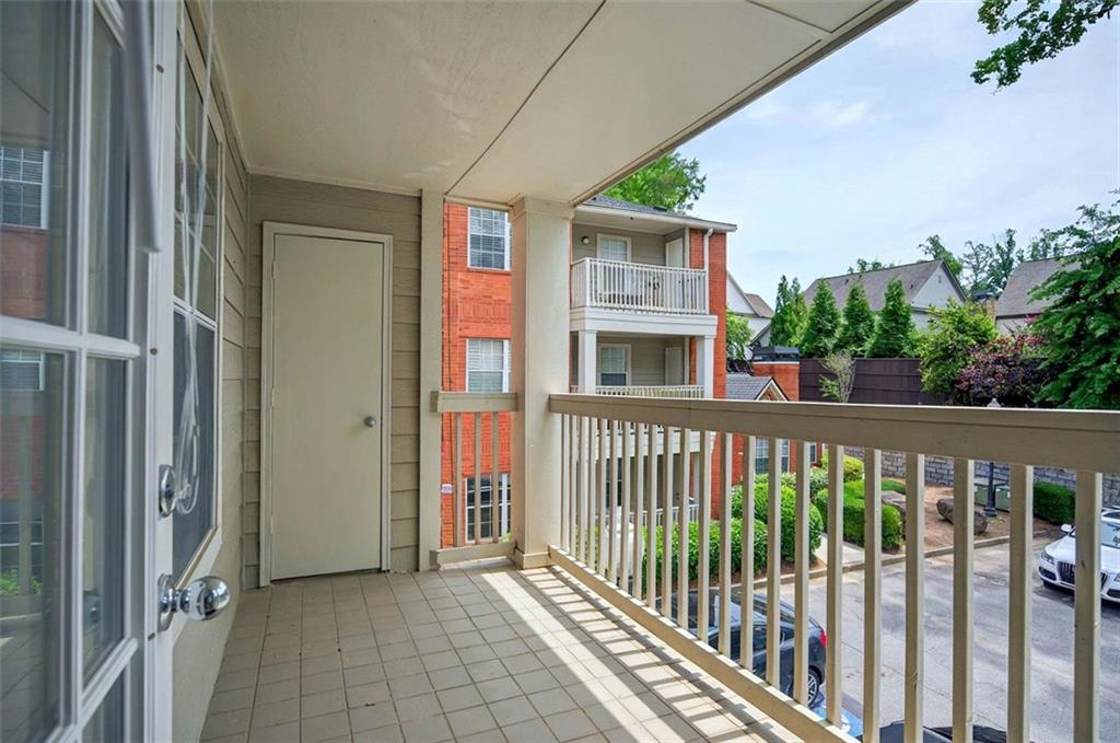 4106 Chastain Park Court Northeast Atlanta, GA 30342 - Photo 18 of 33 a view of a porch with wooden floor and fence
