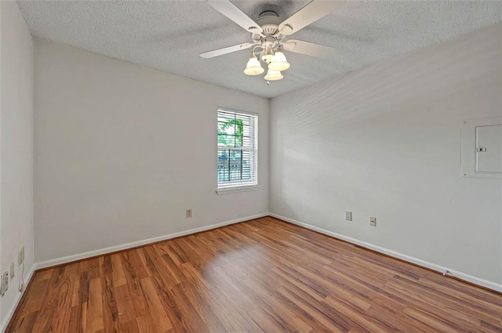 4106 Chastain Park Court Northeast Atlanta, GA 30342 - Photo 21 of 33 wooden floor in an empty room with a window