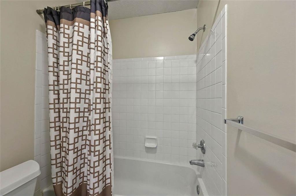 4106 Chastain Park Court Northeast Atlanta, GA 30342 - Photo 24 of 33 a bathroom with a shower