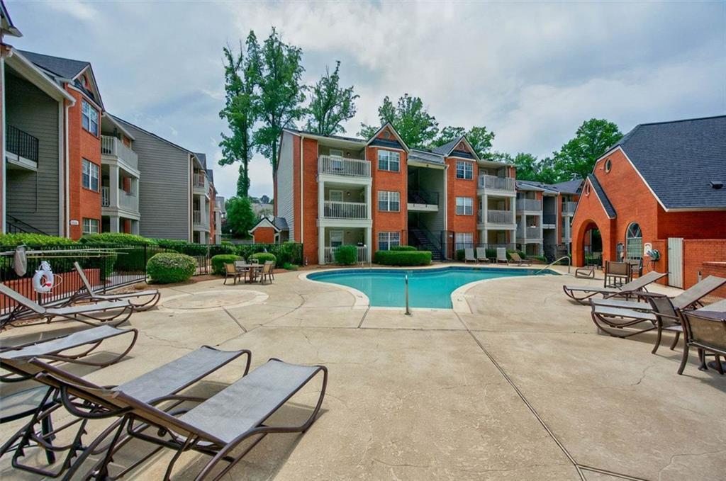 4106 Chastain Park Court Northeast Atlanta, GA 30342 - Photo 30 of 33 a view of a house with backyard and sitting area