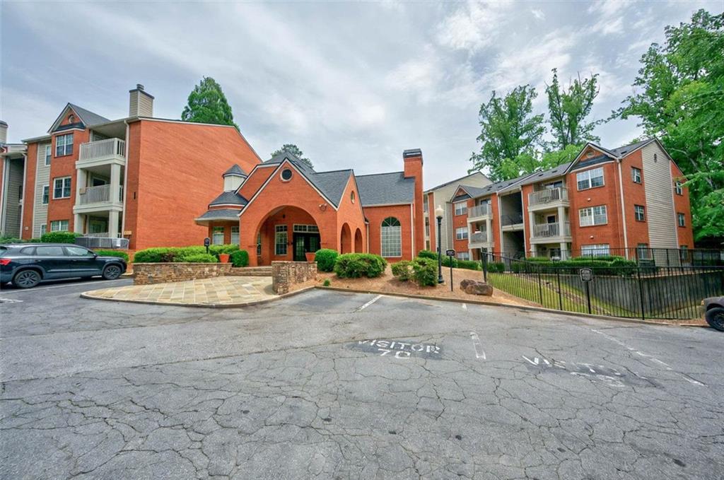 4106 Chastain Park Court Northeast Atlanta, GA 30342 - Photo 32 of 33 front view of house with a yard and potted plants