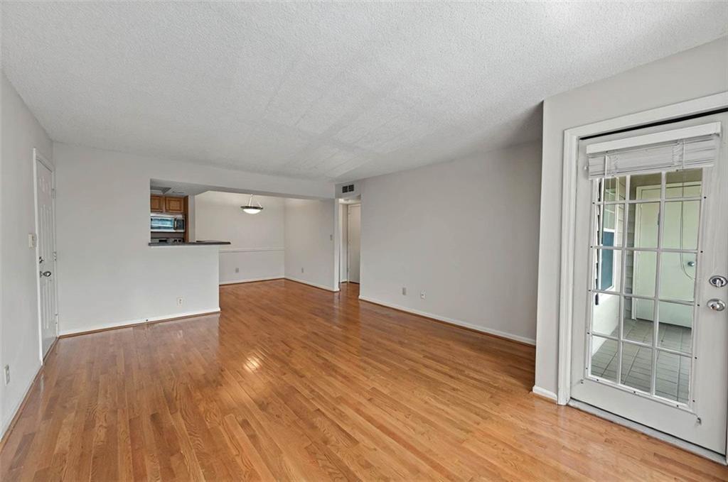 4106 Chastain Park Court Northeast Atlanta, GA 30342 - Photo 10 of 33 a view of empty room with wooden floor