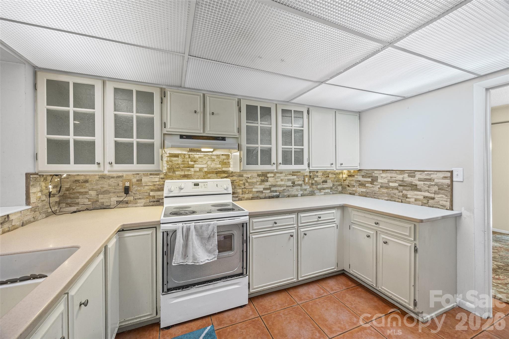 234 Riverview Terrace Clover, SC 29710 - Photo 11 of 35 a kitchen with a stove sink and cabinets
