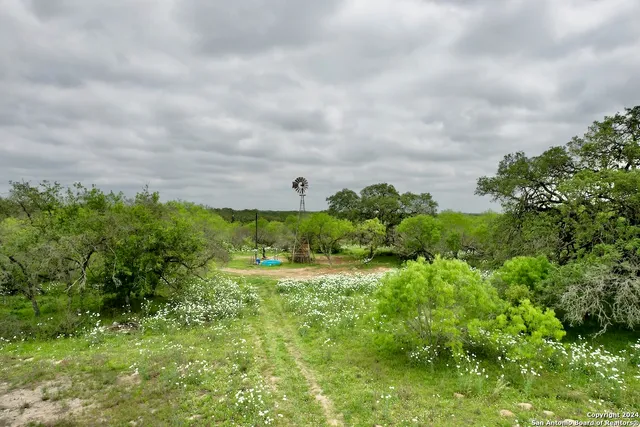 a view of a chairs and table in the patio