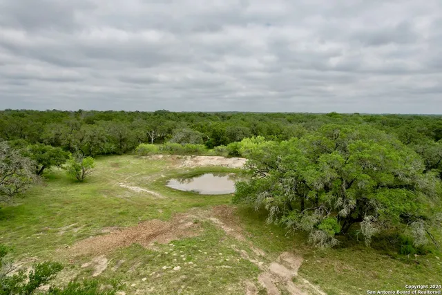 a view of a lake with a yard