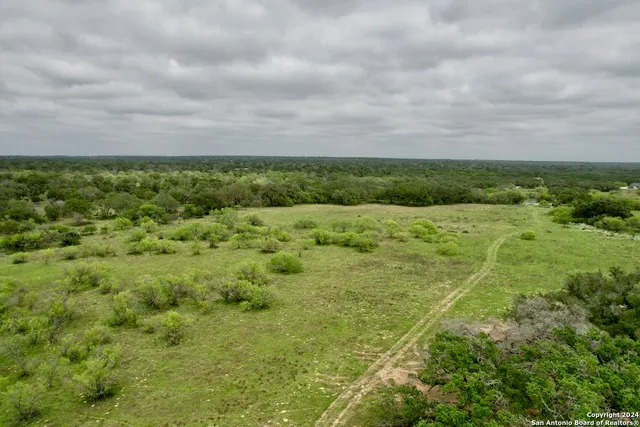 a view of a field with an ocean