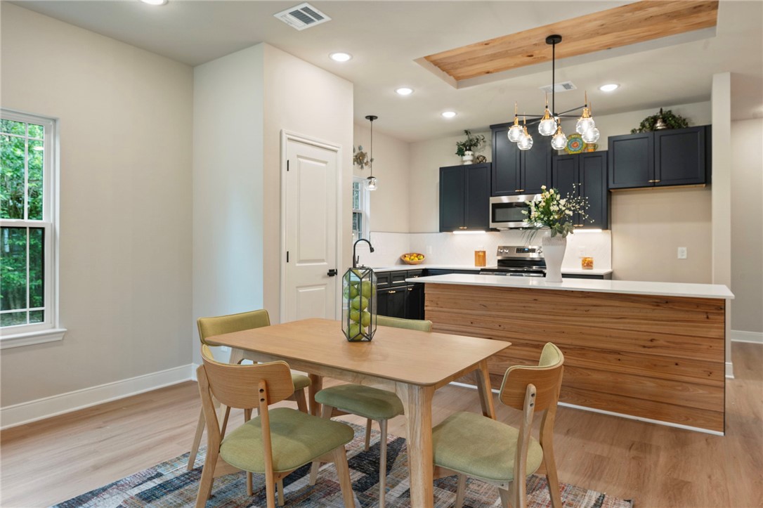 804 East 27th Street Bryan, TX 77803 - Photo 5 of 21 a kitchen with a table and chairs in it