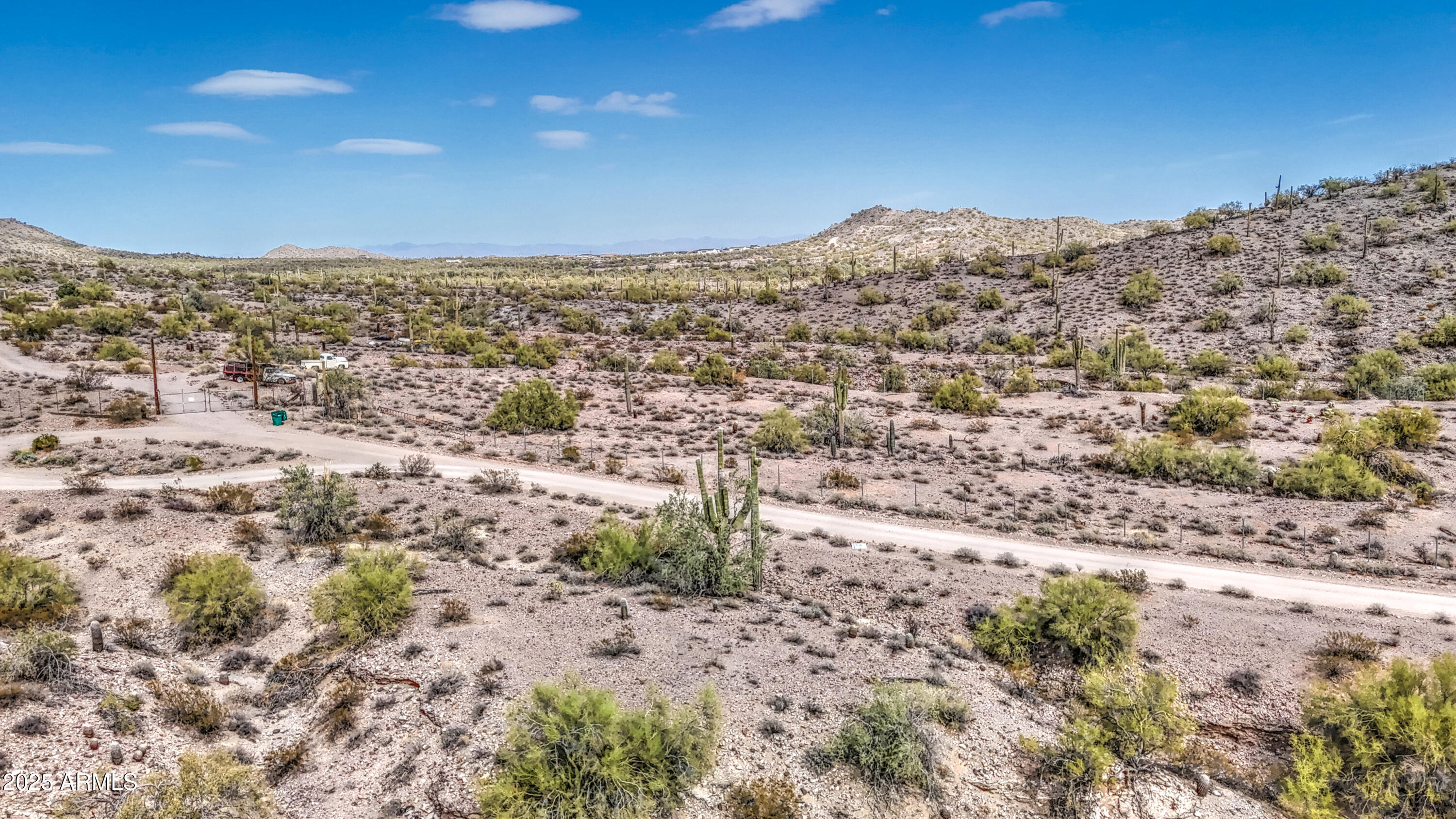 0 North Ellen Road, Unit 7 Queen Creek, AZ 85144 - Photo 23 of 27 a view of a dry yard with wooden fence