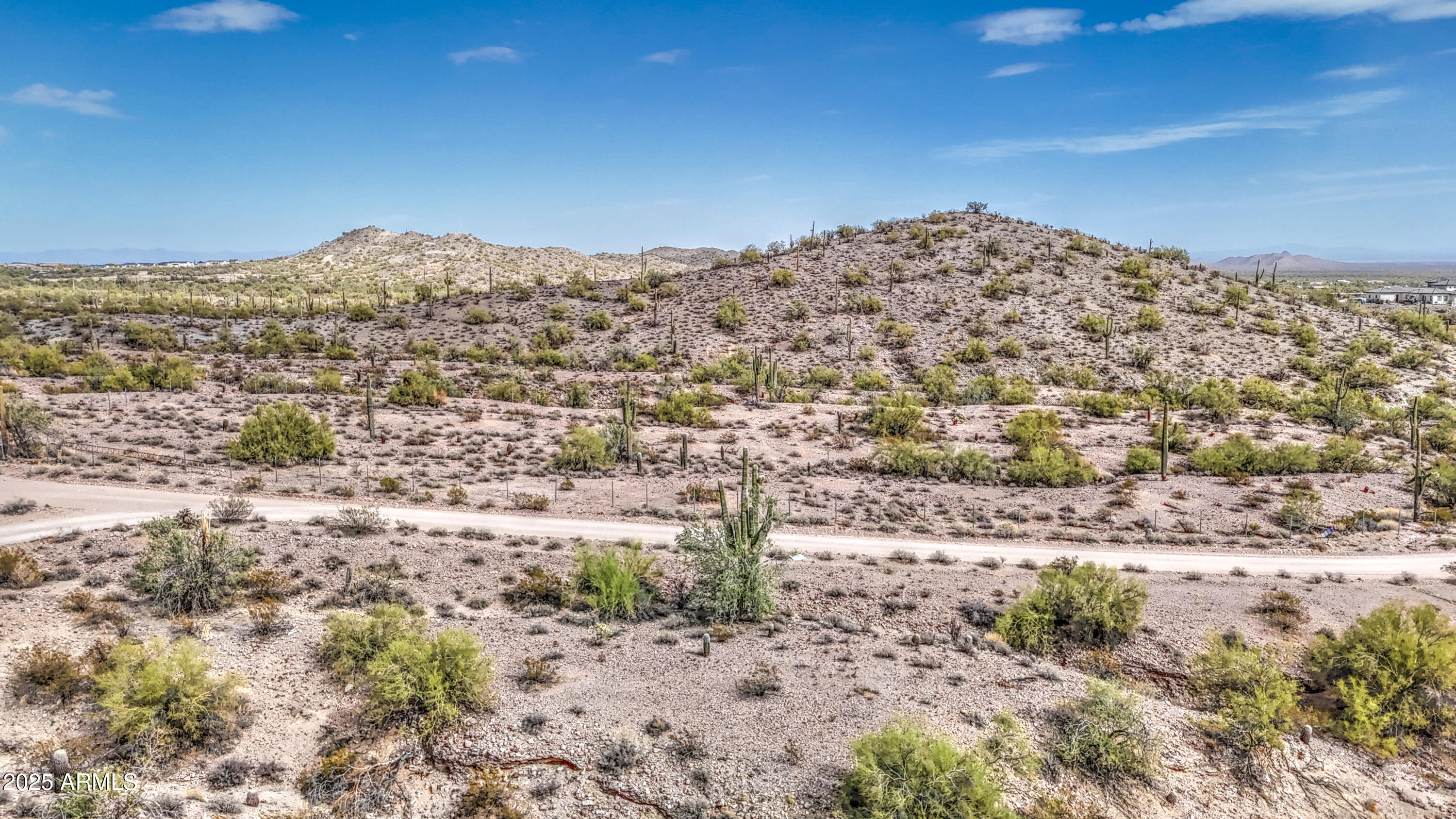0 North Ellen Road, Unit 7 Queen Creek, AZ 85144 - Photo 24 of 27 a view of a large building with mountains in the background