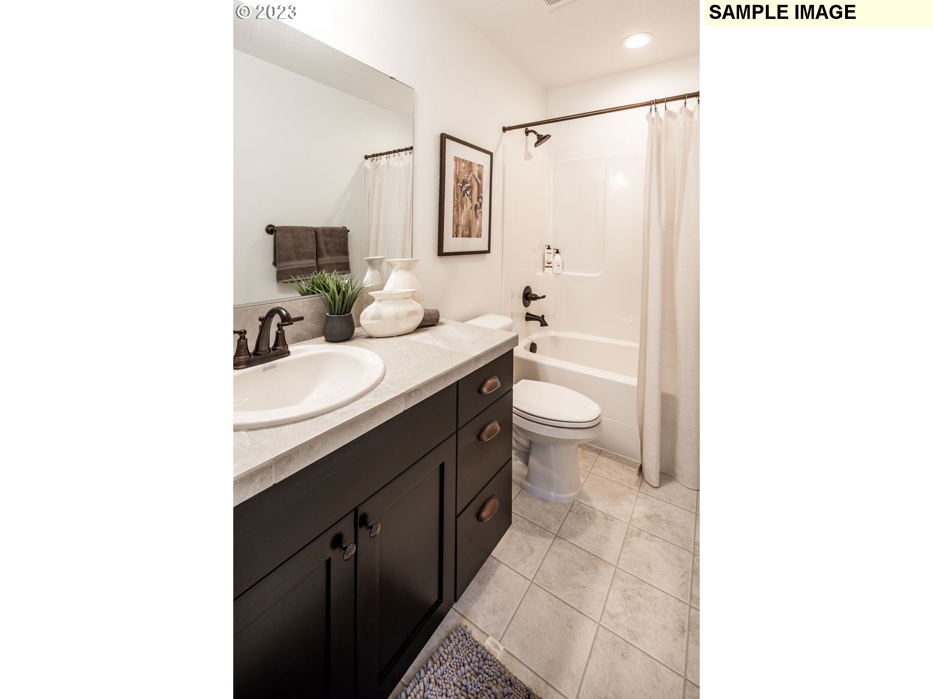 1020 Northwest 178th Street Ridgefield, WA 98642 - Photo 17 of 19 a bathroom with a double vanity sink toilet and mirror