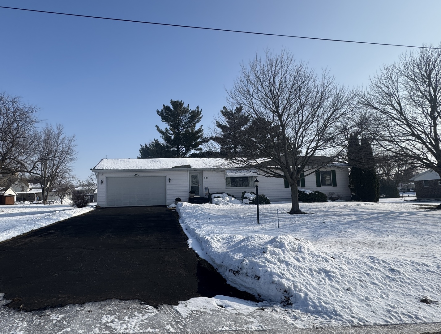 a view of a house with snow on the background
