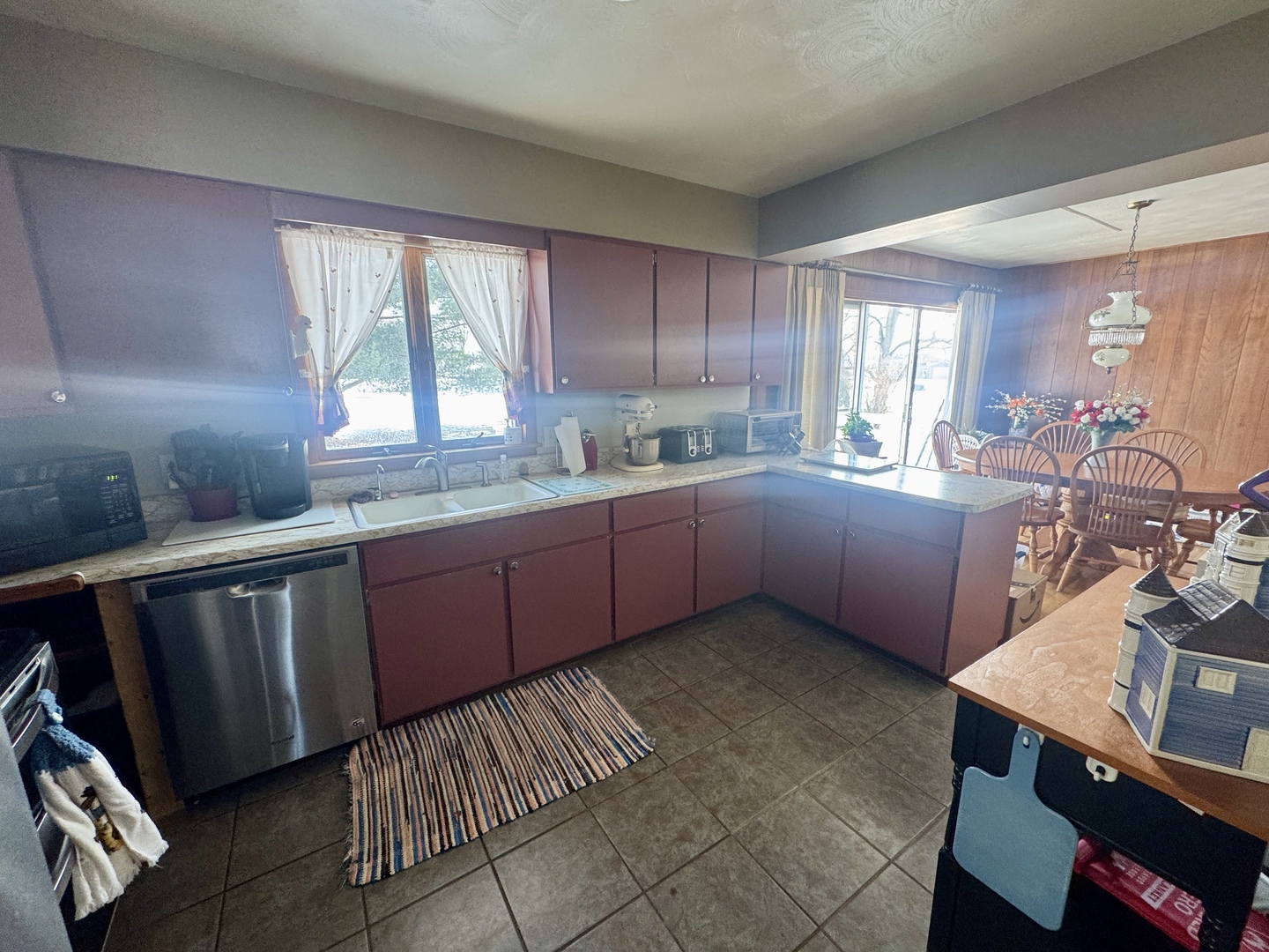 301 South W Street Sublette, IL 61367 - Photo 3 of 8 a kitchen with a sink window and cabinets