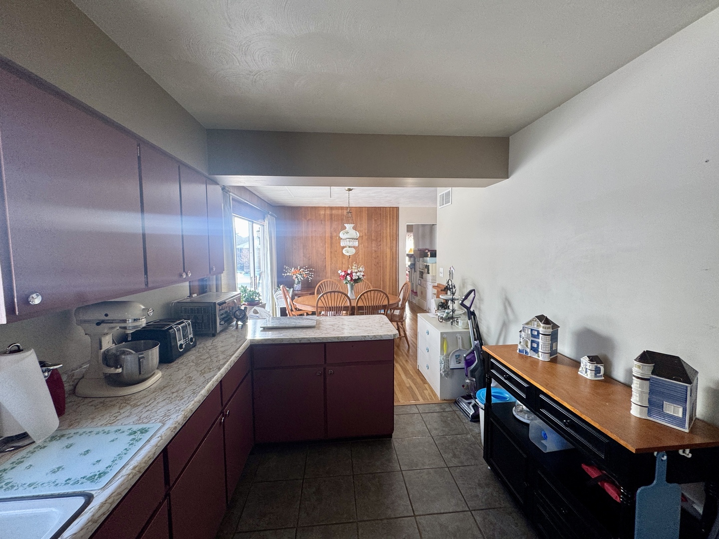 301 South W Street Sublette, IL 61367 - Photo 5 of 8 a kitchen with a sink cabinets and wooden floor