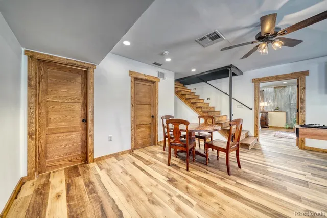 a view of a livingroom with furniture and wooden floor