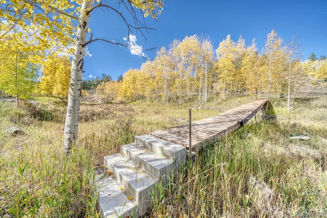 a view of a balcony with floor to ceiling windows